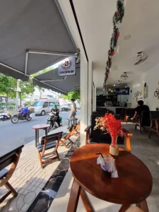 A café with seating along a street in Saigon (aka Ho Chi Minh City), Vietnam.