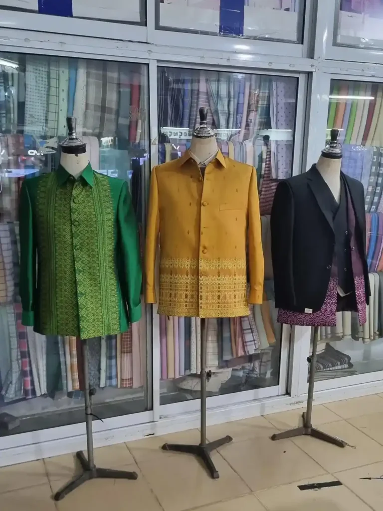 Three formal Cambodian-style long-sleeve men's shirts of various color and pattern imprints.