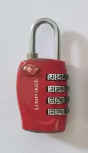 A four pin combination travel lock with metal shackle (locks are also sold that have a cable shackle). This lock is TSA approved.