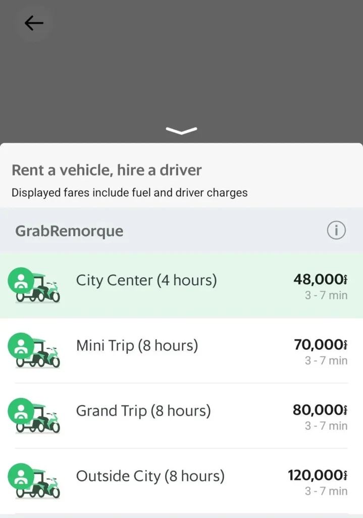 Options for hiring a remorque (a four-seater wagon-style tuk tuk) taxi for a set amount of time via the Grab smart phone app for ride hailing in Cambodia. This shows the available options where pricing is based on the amount of time you need a car driver for. Note: app prices are in Cambodian Riel, but approximate conversion to US dollars is done for convenience. "City Center (four hours)": twelve USD; "Mini Trip (eight hours)": eighteen USD; "Grand Trip (eight hours)": twenty USD; and "Outside City (eight hours)": thirty USD.