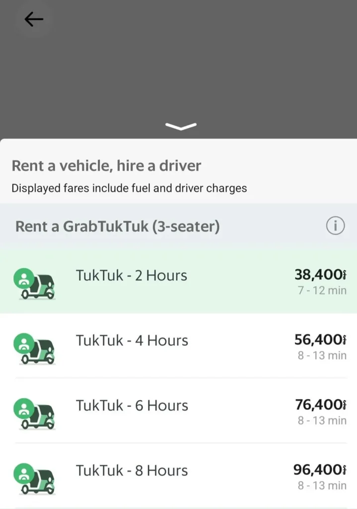 Options for hiring a standard tuk tuk (a three-seater) taxi for a set amount of time via the Grab smart phone app for ride hailing in Cambodia. This shows the available options where pricing is based on the amount of time you need a car driver for. Note: app prices are in Cambodian Riel, but approximate conversion to US dollars is done for convenience. "TukTuk - two hours": ten USD; "TukTuk - four hours": fourteen USD; "TukTuk - six hours": nineteen USD; and "TukTuk - eight hours": twenty-four USD.