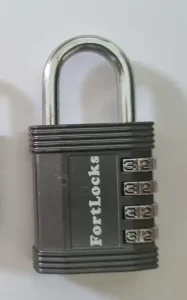 A large-sized four-pin combination travel lock with metal shackle (locks are also sold that have a cable shackle). This large lock is lager in dimension (thicker, and a bit longer) and has a longer & thicker metal shackle. This lock is TSA approved.