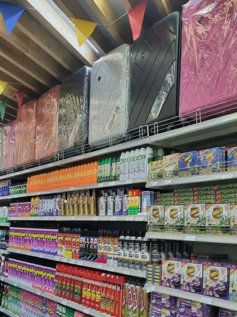 Luggage for sale in a grocery store in Southeast Asia.