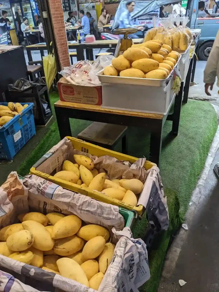 Mango fruit in baskets on display for sale in Bangkok city, Thailand.