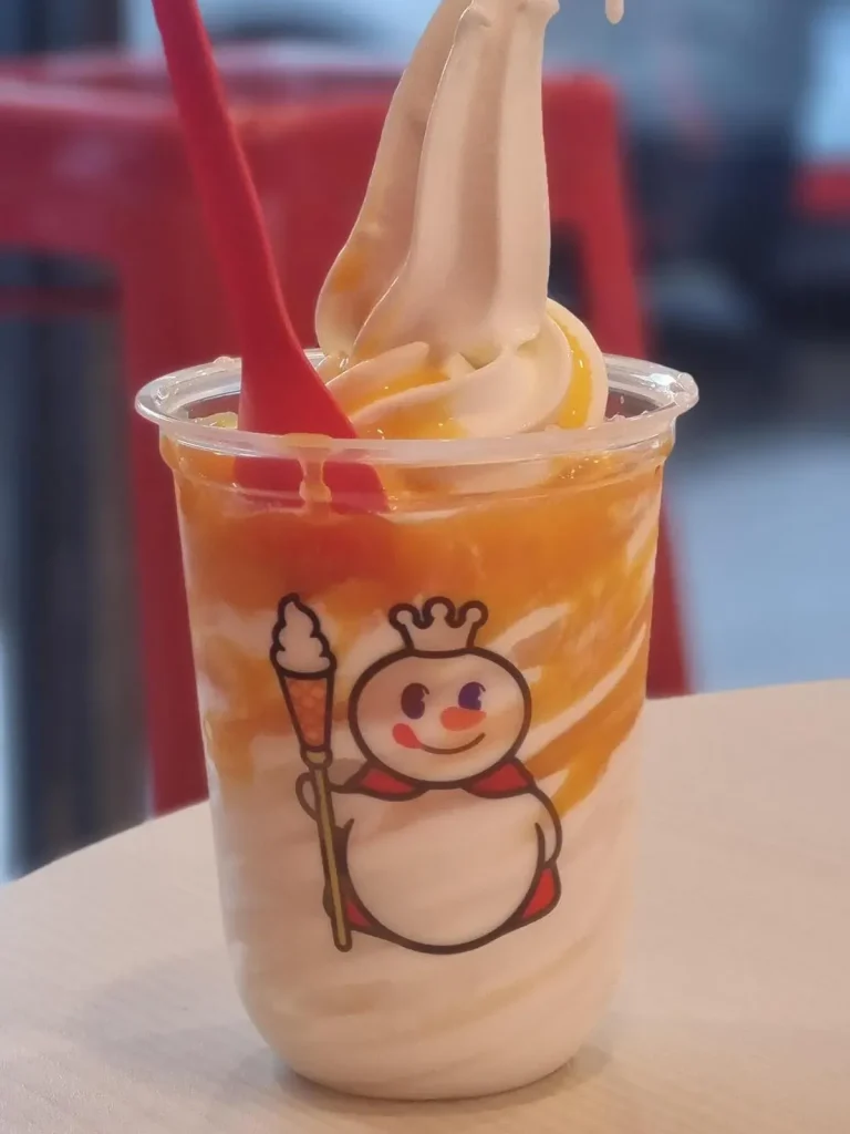 A serving of ice cream in the flavor of mango sticky rice, which is based on a popular desert in Thailand called mango sticky rice. This ice cream parlor is a Chinese chain throughout Southeast Asia called Mi Xue (pronounced "me shoe-eh"). Of course, Asians can be lactose intolerant, so do not expect "real" dairy-based ice cream.