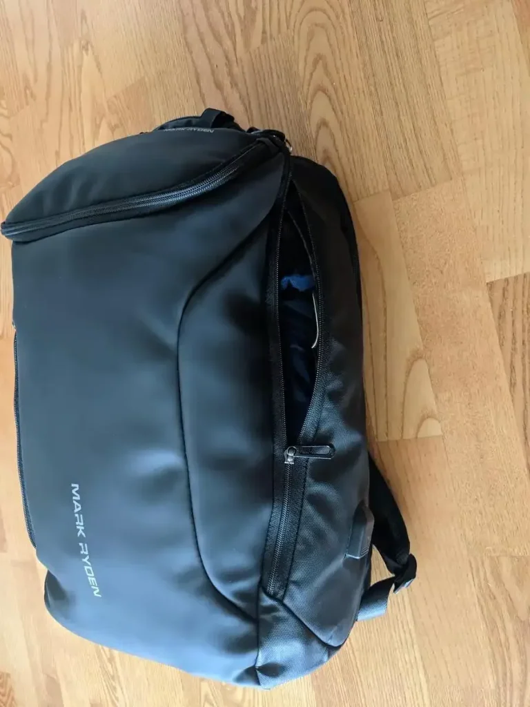 This is a front and side view of the Mark Ryden branded 30 liter backpack with 3 main compartments.
