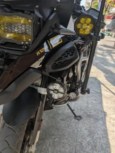 Accessory lighting mounted on the front of a motorbike in Southeast Asia.
