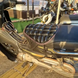 Seat padding accessory on a motorbike in Southeast Asia.