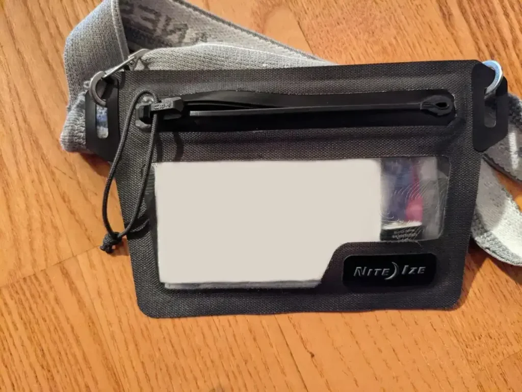 Nite Ize branded waterproof wallet that is concealable under clothing by using an attached elastic belt.