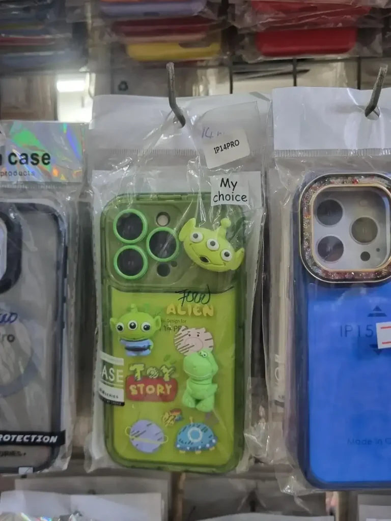 iPhone phone case. A Toy Story phone case for iPhone sold in Southeast Asia. It has a few characters on it from the Toy Story movie. It is a slimy green color, and says "Alien" and "Toy Story" on it.