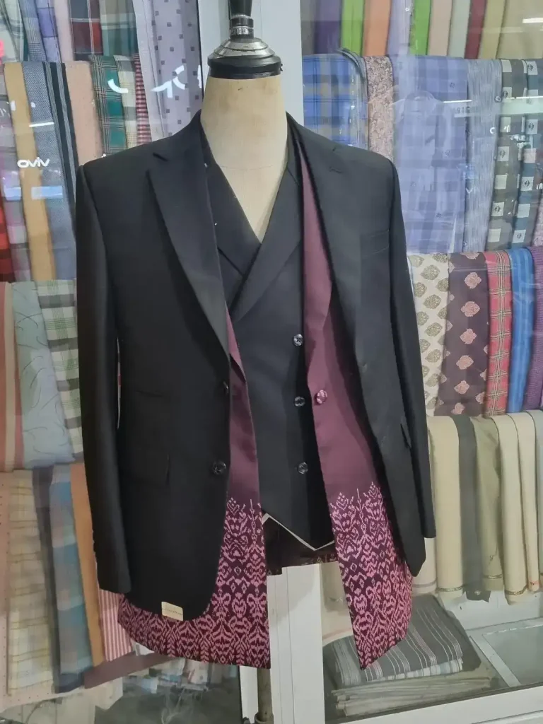 A formal Cambodian-style men's suite with best and long-sleeve shirt of yellow color and pattern imprints on a mannequin.