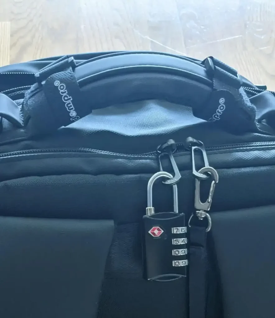TSA travel lock on travel bag to prevent theft.