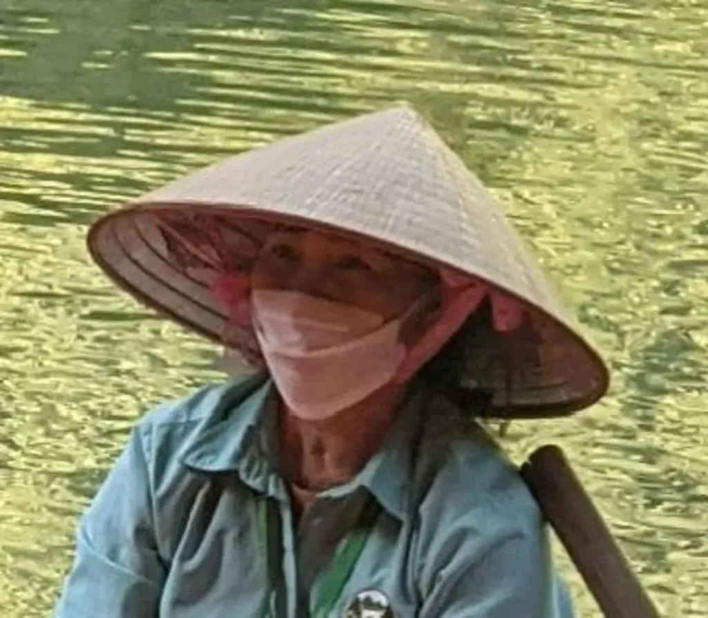 A Vietnamese-style straw hat. These are hand-made. Thai, Khmer (Cambodian), and Vietnamese straw hats all different. Vietnamese are conical, while Cambodian staw hats are like a bucket hat. The Thai version are similar to the Cambodian one, but with some hard-to-describe shape differences.