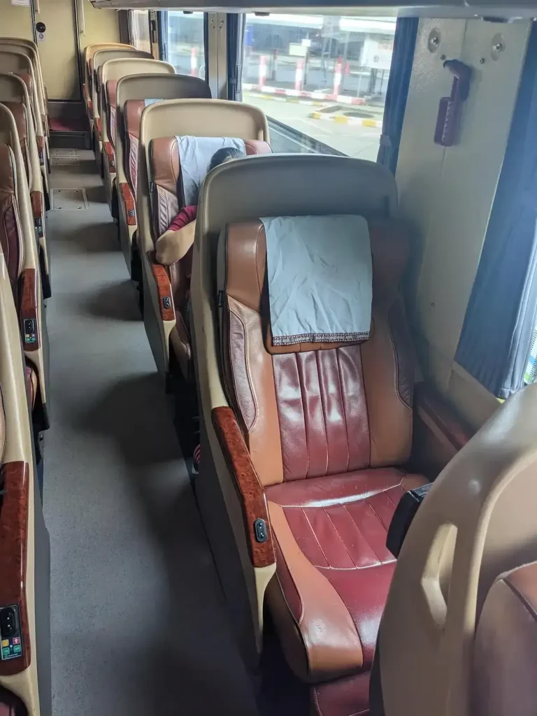 VIP bus that can be taken between cities or do a land border crossing from one country to another in Southeast Asia. Inner cabin seating with toilet in the back.