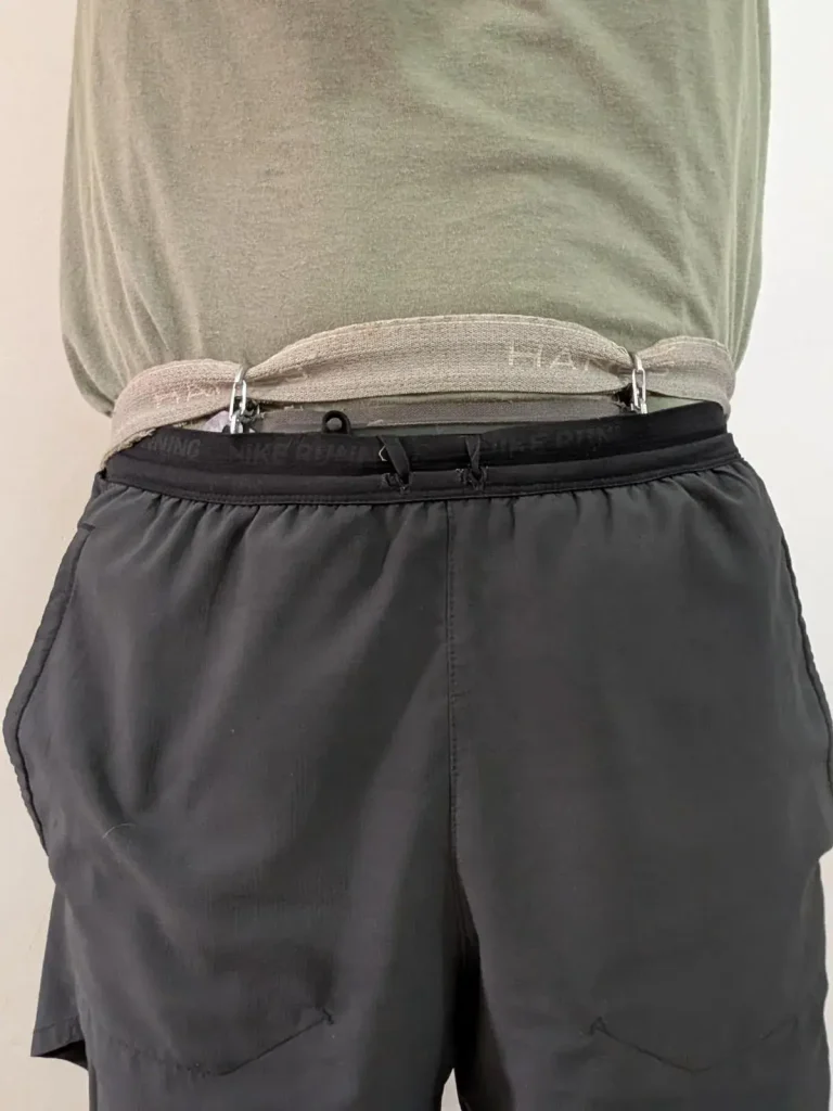 Wearing a Nite Ize branded wallet, partially concealed, with the wallet tucked inside/underneath of pants.