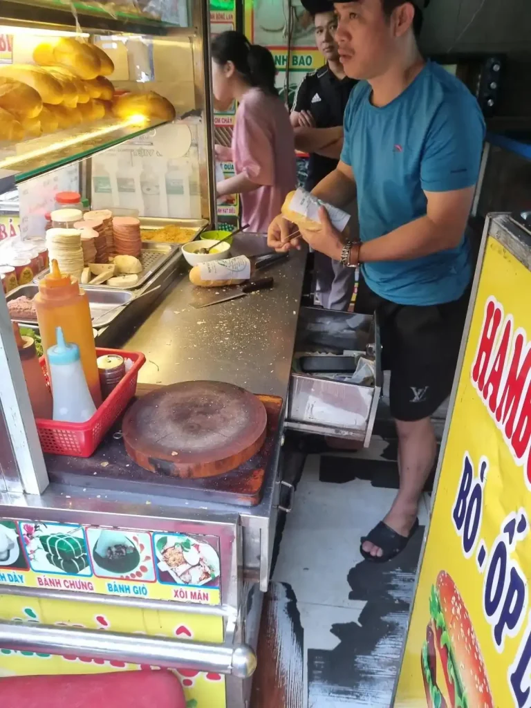 This image of cash thrown into a drawer, unorganized, demonstrates the lack of formal financial accounting in Southeast Asia. This is the cash register at a bahn mi stall in Vietnam.