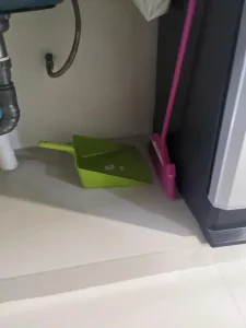 A broom and dust pan. This is often, but not always, included with furnished housing in Southeast Asia.