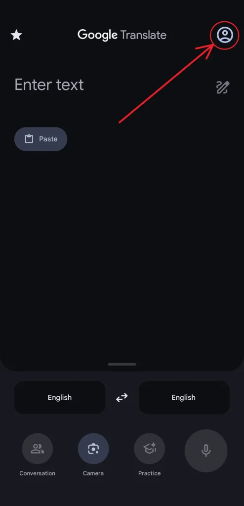 A screenshot of the Google Translate app. There is an arrow pointing to the account setting button in the upper right-hand corner of the app. This is, in part, to guide you where to find "Downloaded lanuages". The rest of the image shoes the place to enter text for translating, the current language and the language to translate it to. Also, at the bottom are the following four buttons: "Conversation", "Camera", "Practice", and a button with only a microphone icon.