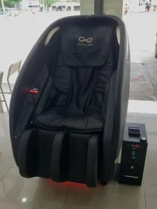 A money-operate massage chair at a laundromat in Southeast Asia. It looks very comfortable.