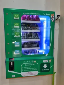 A vending machine at a laundromat in Southeast Asia selling packets of laundry detergent to wash a single small load of clothing.