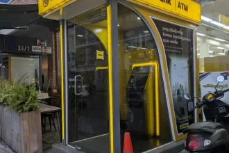 A Maybank ATM outside a store in Southeast Asia. Maybank is a Muslim Malaysian bank.