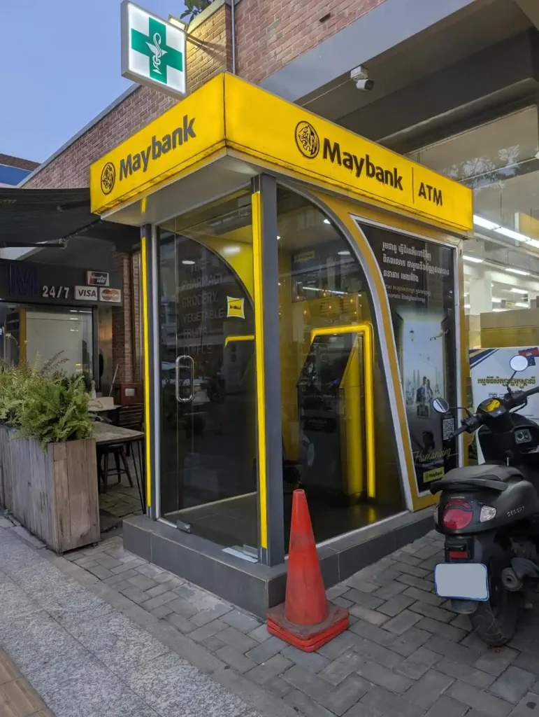 A Maybank ATM outside a store in Southeast Asia. Maybank is a Muslim Malaysian bank.