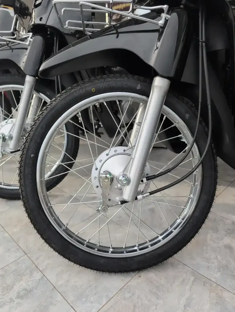 A drum brake (not disk brake, which is preferred) on the front wheel of a motorbike (scooter, motorcycle).
