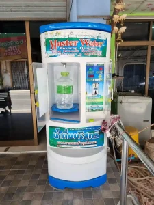 A reverse osmosis machine for clean filtered water in Southeast Asia. This machine happens to be located in Thailand. The price is one Thai Baht for one liter.