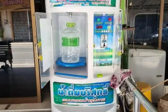A reverse osmosis machine for clean filtered water in Southeast Asia. This machine happens to be located in Thailand. The price is one Thai Baht for one liter.