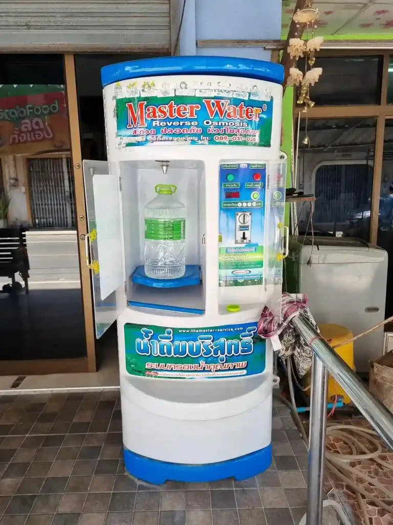 A reverse osmosis machine for clean filtered water in Southeast Asia. This machine happens to be located in Thailand. The price is one Thai Baht for one liter.