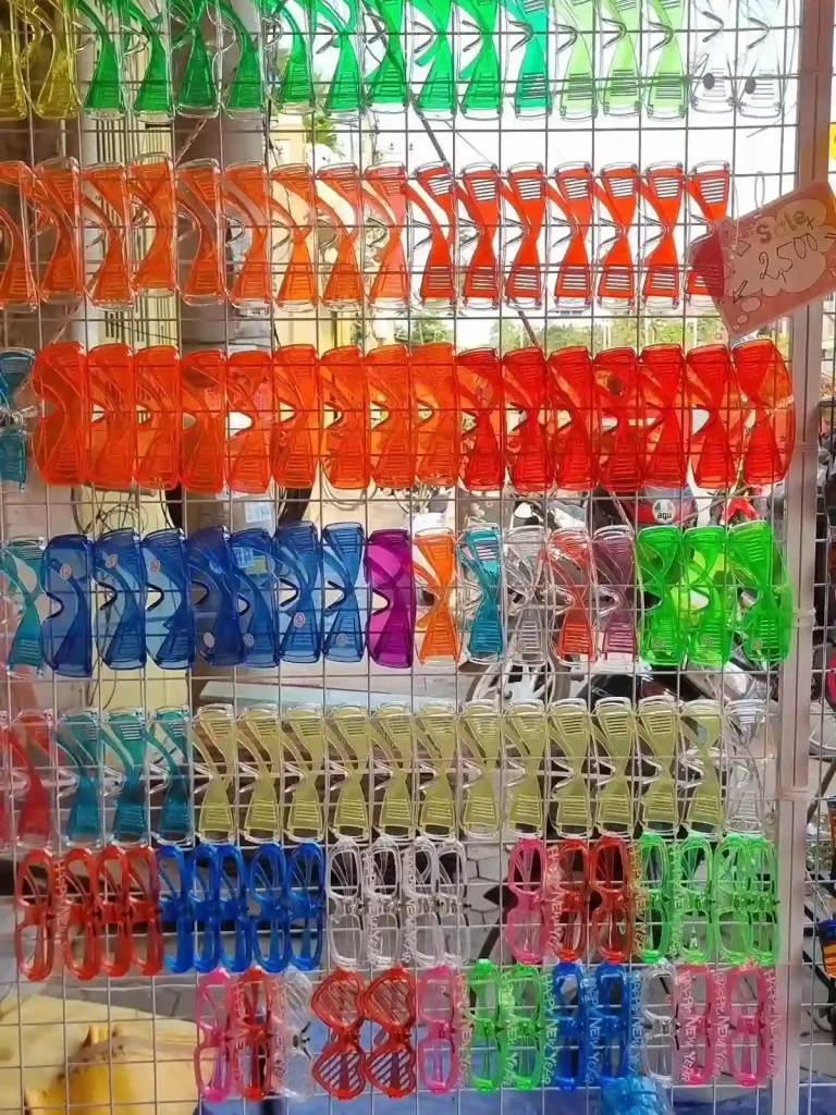 Eye protective glasses of various color being sold in preparation of the Songkran festival. This festival is essentially one massive water fight, and everyone gets soaking wet.