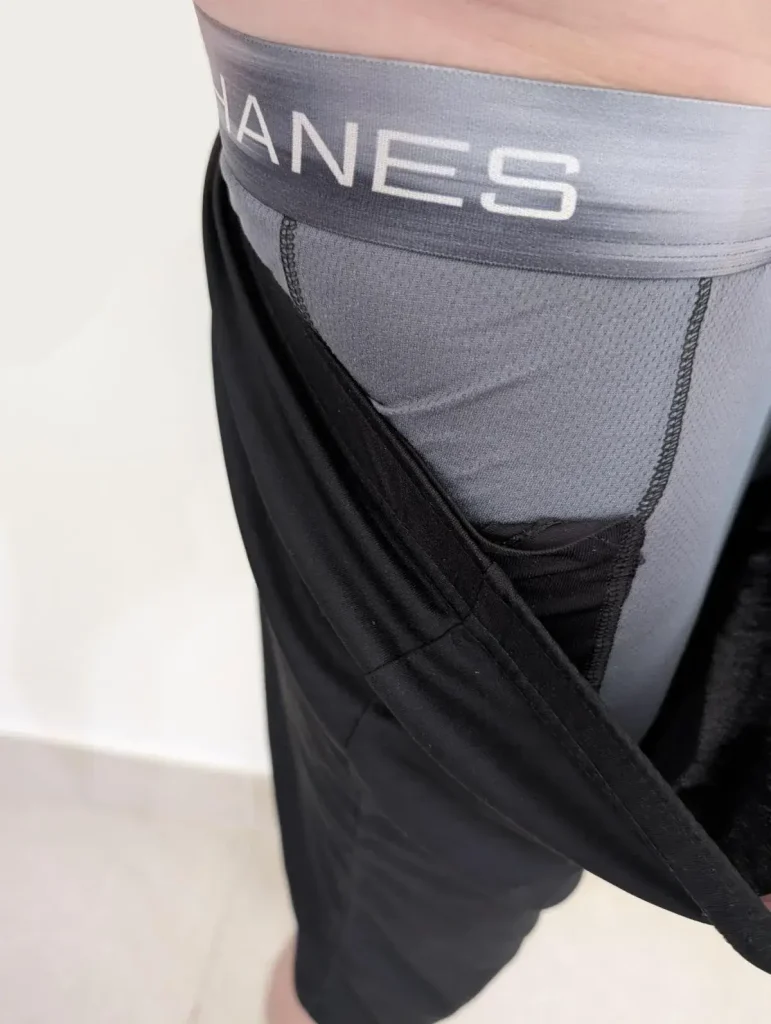 Underwear with a pocket on it that is concealed under clothing. A pair of spandex underwear that has a built-in storage pocket concealed under clothing. This is meant to show how it is impossible for pickpocket to reach in a steal something from the pocket. Also, the pocket prevents loosing things easily, that would normally fall out of a regular pants pocket. The pocket is on the right-hand leg side.